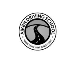 Mark drawing for AIKEN DRIVING SCHOOL · "WHERE YOU'RE IN THE DRIVER'S SEAT!"·